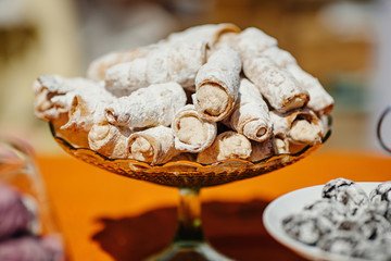 Dessert table at kids birthday party. Cake, candies, marshmallows, cakepops and other sweets