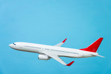 white airplane on a blue background