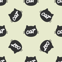 Silhouette of feline head with handwritten text Cat. Color seamless pattern.