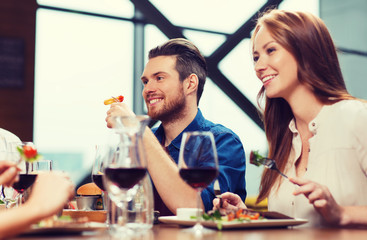 happy couple having dinner at restaurant