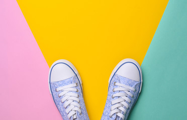 Sneakers on a multicolored pastel background
