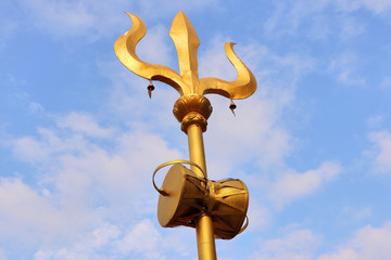 Fototapeta na wymiar Lord Shiva’s Trident up in the open sky, symbol of the three universal supreme powers, according to Hindu myths.