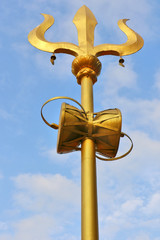 Lord Shiva’s Trident up in the open sky, symbol of the three universal supreme powers, according...