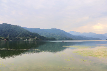 Phewa Lake in Pokhara, second largest freshwater lake in Nepal, famous for the reflection of Machhapuchhre & other mountain peaks on its surface.