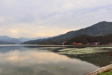 Phewa Lake in Pokhara, second largest freshwater lake in Nepal, famous for the reflection of Machhapuchhre & other mountain peaks on its surface.