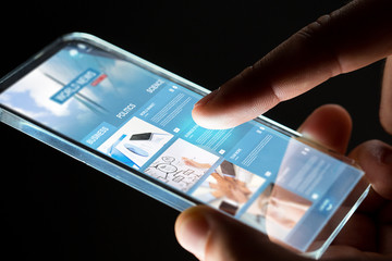 hands with business web page on smartphone screen