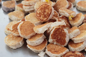 flour mix coconut and then fried ,Thai dessert.