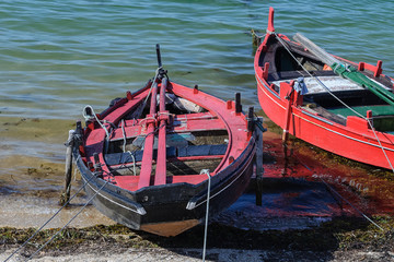 wooden fishing boat moored near the shore