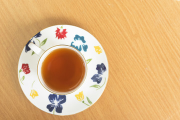 Top view of a tasty cup of hot tea on the table