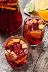 Sangria drink in glass on wooden table
