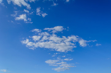 White clouds in deep blue sky