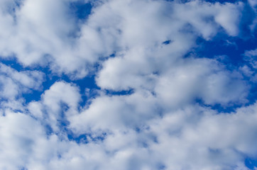 White clouds in deep blue sky