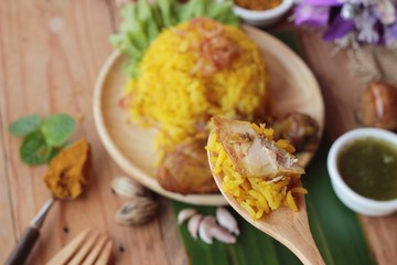 chicken biryani with rice delicious and sauce.