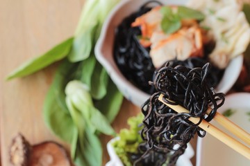 black noodles with pork and dumpling delicious