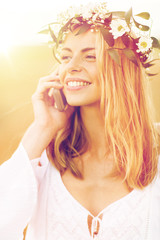 Fototapeta premium happy young woman calling on smartphone at country