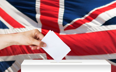 Fototapeta na wymiar hand of englishman with ballot and box on election