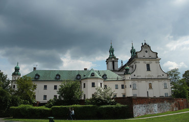 Fototapeta na wymiar Baroque church on the rock beneath the cloudy sky in Cracow, Poland