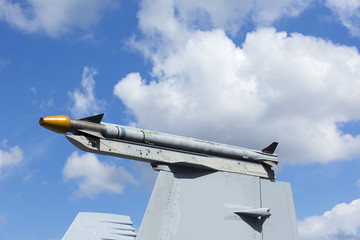 Missile on the top of the jet fighter wing.