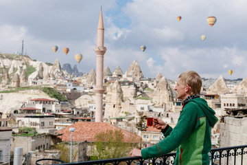 drinking turkish tea in front of old city Goreme