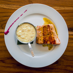 Salmon steak with smashed potatoes gourmet cuisine