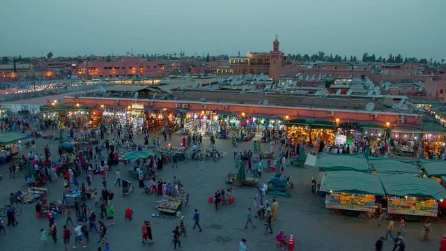 Time lapse with walking crowd of people, city square of Marrakesh in Morocco