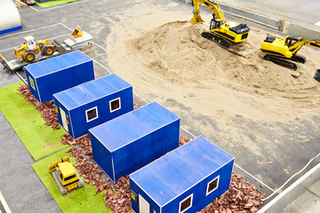 Layout of construction site with trailers and excavators