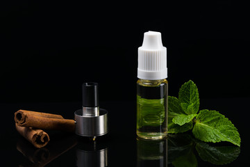 Obraz na płótnie Canvas Set for the disclosure of tastes of cinnamon on a black background vaping
