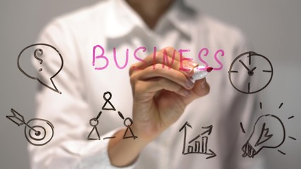 Woman writing Business on transparent screen. Businesswoman write on board.