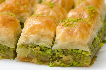 Baklava with pistachio on a white background