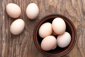fresh uncooked brown hen eggs. Top view