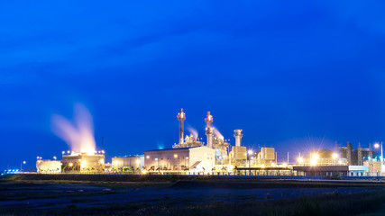 Plakat power plant on twilight sky.