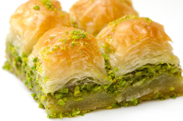 Baklava with pistachio on a white background