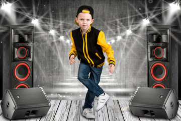 The little boy in the style of Hip-Hop . Children's fashion.Cap and jacket. The Young Rapper.Cool...
