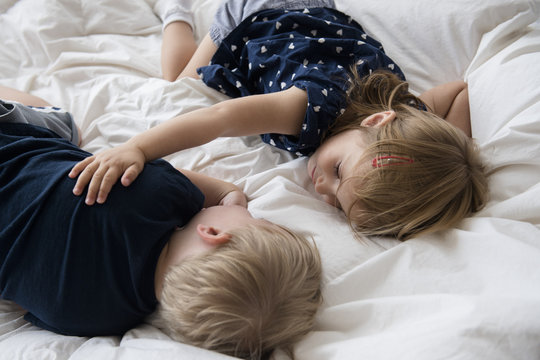 540px x 360px - Brother and sister sleeping on bed Stock Photo | Adobe Stock