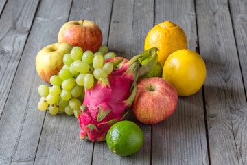 Exotic and traditional fruits on a wooden table