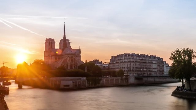 Timelapse Sunset with Notre-Dame Cathedral and the Seine river in Paris, France