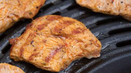 meat, pepper, mushrooms and sausages on the BBQ.