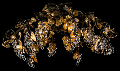 Classic chandelier in flower style isolated on black background.