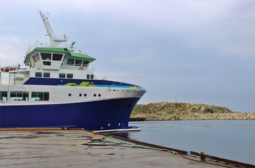 Naklejka premium A car has arrived in the northern port of the small island Utsira, Norway. The distance to the mainland, the town Haugesund, is about 18 km. Scandinavia, Europe.