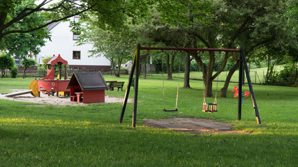 Obraz na płótnie Canvas children's Playground with swing set without 
