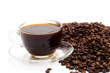 Grains of coffee and a cup of black coffee on a white background, studio light