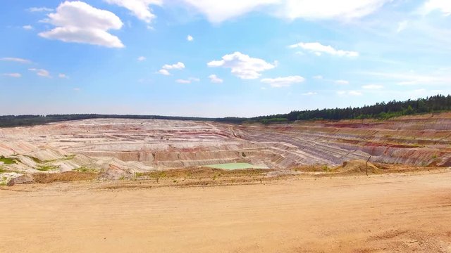 Kaznejov kaoline quarry. Camera flight over largest quarry of its kind in Europe. Heavy industry from above. Industrial area and devastated landscape in Czech Republic. 
