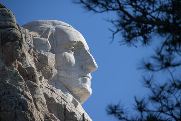 A profile view of George Washington's face on Mount Rushmore in South Dakota. - Powered by Adobe