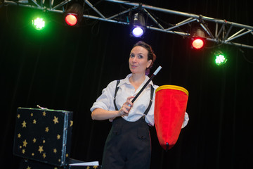 woman magician at stage