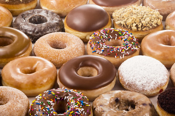 Background of Assorted Donuts (Doughnuts) of Various Flavors - obrazy, fototapety, plakaty