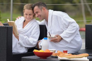 couple laughs and hugs happily on their summer holidays