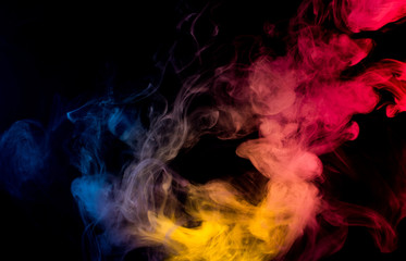 Fototapeta na wymiar colorful smoke on black background 