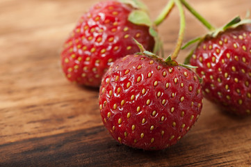 Strawberry on an old wooden background.