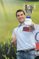 golfer winner with trophy