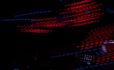 Disco lights synthwave synth wave vapor tron fairground funfair ride lights at night moving  fast...